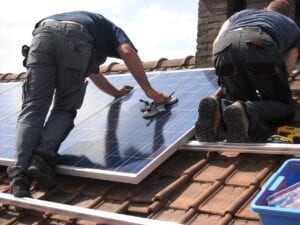 solar-panels-two men fitting to roof of house
