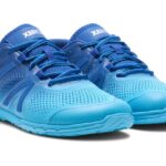 A pair of bright blue barefoot athletic shoes with a mesh design and textured soles offers comfort for digital nomads on the move. With blue laces and "XERO" on the tongue, these shoes sit against a plain white background.